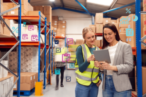 two female employees managing inventory in a warehouse